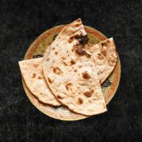 Tandoori Roti (Vegan) · Whole wheat flat bread baked to perfection in an Indian clay oven.