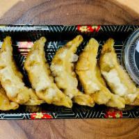 Beef Gyoza (6 Pcs) · Japanese seared beef stuffed pot stickers served with special dipping sauce