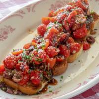 Brushetta · Tomato, fresh basil, kalamata olives, roasted garlic, balsamic vinegar