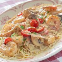 Shrimp Scampi · Garlic butter, white wine, mushrooms, tomatoes, angel hair pasta