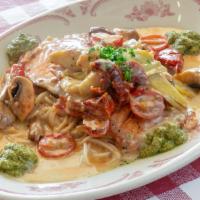 Salmon · Artichoke, tomato, mushroom, lemon butter, basil pesto, spaghetti.