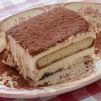 Tiramisu · Lady finger cookies,soaked in coffee and rum, layered with mascarpone cheese
