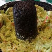 Guacamole Al Molcajete · Fresh avocado and pico de gallo with a hint of lime, and serrano pepper served with chips.