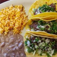 Taco Plate · Order of three delicious double corn tortillas filled with your choice of fajita steak or ch...