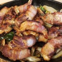 Shrimp Fajitas · Twelve bacon wrapped shrimp with sautéed onion, and peppers. Served with rice, beans, pico d...