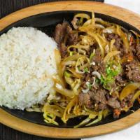 Korean Bulgogi · Thinly sliced rib eye sauteed with carrots and onions in a sweet and savory Korean style sau...