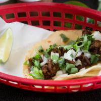 Tacos · Flour or corn tortilla taco served with your choice of meat and onions and cilantro