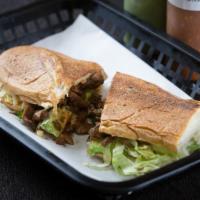 Mexican Torta · Served with Onions,Cilantro, Cheese,Lettuce, Sour Cream and Avocado.