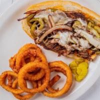 Philly Cheese Steak · THIN SLICED BEEF GRILLED WITH PEPPERS, ONIONS, AND SMOTHERED WITH CHEESE