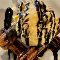 Churros · CINNAMON DUSTED CHURROS SERVED WITH FRENCH VANILLA ICE CREAM AND CHOCOLATE SAUCE. AMAZING!!!!