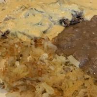 Lucy'S Famous Machaca Breakfast · Shredded beef or chicken with tomatoes, onions, and eggs smothered in a generous serving of ...