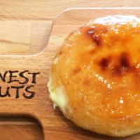 Creme Brulee · Crunchy caramelized sugar topping on a raised yeast donut with bavarian cream filling.