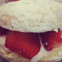 Strawberry Shortcake · A powdered sugar raised donut full of fresh strawberries and whipped cream.