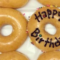 Happy Birthday · One glazed donut with Happy Birthday written on it.