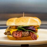 The Early Riser · 1/4 lb gourmet burger with fried egg, two pieces of bacon, & cheese.