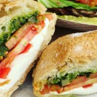 Veggie Avocado Deluxe · On Bakehouse rustic roll, with vegenaise, green leaf lettuce, local tomatoes, red onions, lo...
