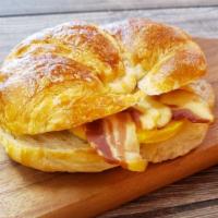 Breakfast Croissant Sandwich · Ham with egg and cheese ,  bacon with egg and cheese, sausage with egg and cheese  ,