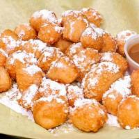 Zeppoles · Fried Fresh Dough balls garnished with Powdered Sugar. Served with your choice of dip.  Choo...