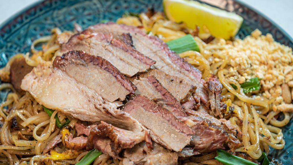 Brisket Pad Thai · Texas twisted Bangkok flavors of tangy, a little sweet and spicy with smoked brisket, thin rice stick noodles stir-fried with eggs, bean sprouts, and green onions served with crushed peanut and lime on the side.