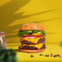 Cloned Cheese Burger  · Two seasoned Beyond meat patties topped with melted vegan cheese, lettuce, tomato, onion, an...
