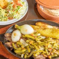 Fajitas Mixtas Platillo · Steak chicken fajitas served with salad, beans and rice.