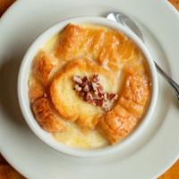 White Chocolate Bread Pudding · With bourbon sauce and pecans.