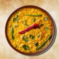 Yellow Dal Tadka · Yellow lentils, cooked to perfection over a slow flame and tempered with 'ghee' and spices, ...