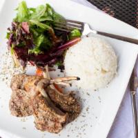Lamb Chops · Half rack of grilled lamb chops served with a side of rice, half pita, grilled tomato and Gr...