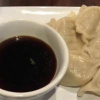 Dumplings (6) · Made with chicken. Served with garlic dipping sauce.