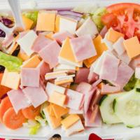 Chef Salad · Ham, turkey, swiss and American cheese over our veggie salad.