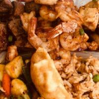 Three Meat Plate  · Steak, Shrimp, and  Chicken comes with mix vegetables and fried rice or steam rice