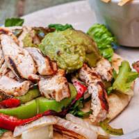 Chicken Fajita Caesar Salad · Fajita chicken, grilled bell peppers and onions, pico de gallo and Caesar dressing. Gluten f...