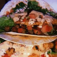 Fish Tacos · Catfish on flour tortillas with lettuce, tomatoes, pico de gallo and chipotle ranch.