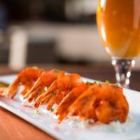 Buffalo Shrimp · Crispy jumbo shrimp, bleu cheese crumbles, bleu cheese dressing, buffalo sauce.
