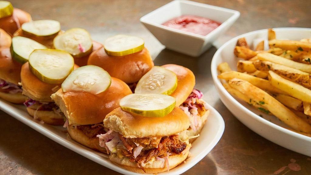 Mini Pulled Pork Sandwiches · Hand pulled Hardwood-smoked pork shoulder, bbq sauce, cider mustard, coleslaw, spicy bread and butter pickles, toasted brioche bun.. 12 mini sandwiches.. Served with fries or side salad.. Carry out only. Serves 4-6.