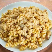 Smoked Cheddar Mac N Cheese · Grilled chicken, bacon lardons, smoked cheddar cheese sauce, cavatappi.. Comes with choice o...