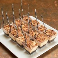 Snickers Pie Shooters · 12 shooters of Oreo cookie crumb, peanut butter mousse, chopped snickers bar topping.. Carry...