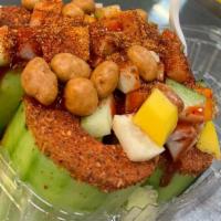Pepino Lokos · Cucumbers bowl with mango and jicama pieces and peanuts and tamarindo candy bits with chile ...