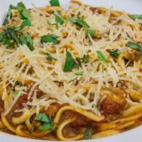 Spaghetti With Meat Sauce · served with spaghetti, chicken, mushroom, simmered tomato sauce, and parmesan cheese