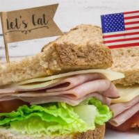 Ham & Cheese · Black forest ham, Swiss cheese, mayonnaise, lettuce and tomato served on your choice of bread.