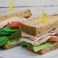 Oven Roasted Turkey Breast · Oven roasted turkey breast, mayonnaise, lettuce and tomato served on your choice of bread.