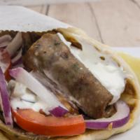 Gyro · Grilled lamb with red onion, tomato and tzatziki sauce, served on pita bread.