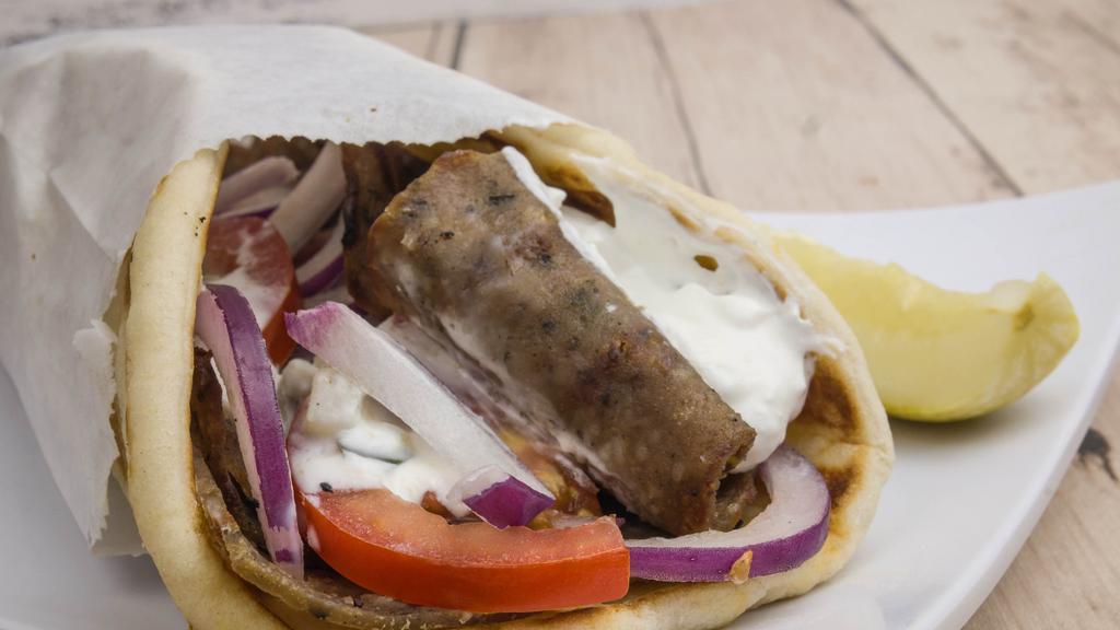 Gyro · Grilled lamb with red onion, tomato and tzatziki sauce, served on pita bread.