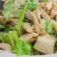 Caesar Salad With Grilled Chicken · served with romaine lettuce, homemade croutons and red cabbage tossed with Caesar dressing a...