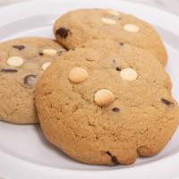 Chocolate Chip Cookie · Homemade Chocolate Chip cookie with white chocolate chips topping. Baked fresh daily