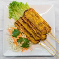 Satay Chicken (5) · GF - Served with peanut sauce and cucumber sauce, curry marinated chicken skewers.