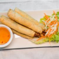 Shrimp Blankets (5) · Served with thin sweet & sour sauce, whole marinated shrimp, and green onion in a crispy wrap.