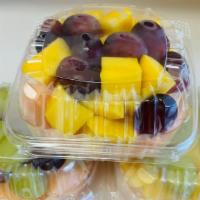 Mix Fruit · the box contain cantaloupe , grape, and mango, strawberry.
