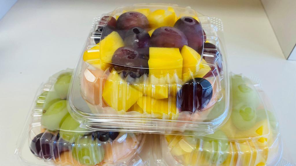Mix Fruit · the box contain cantaloupe , grape, and mango, strawberry.