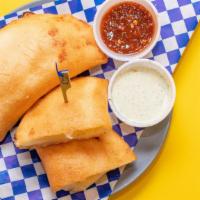 Cheese Criolla Empanadas · A deep fried sweet corn dough wraps the most delicious fillings.